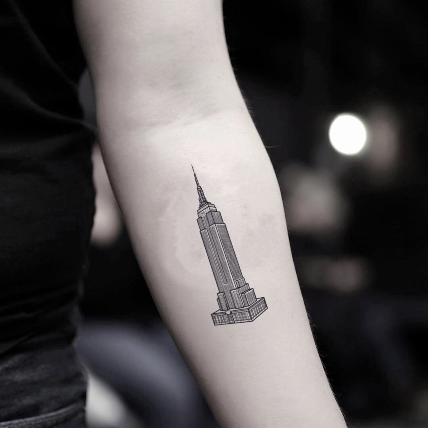 fake small empire state building illustrative temporary tattoo sticker design idea on inner arm