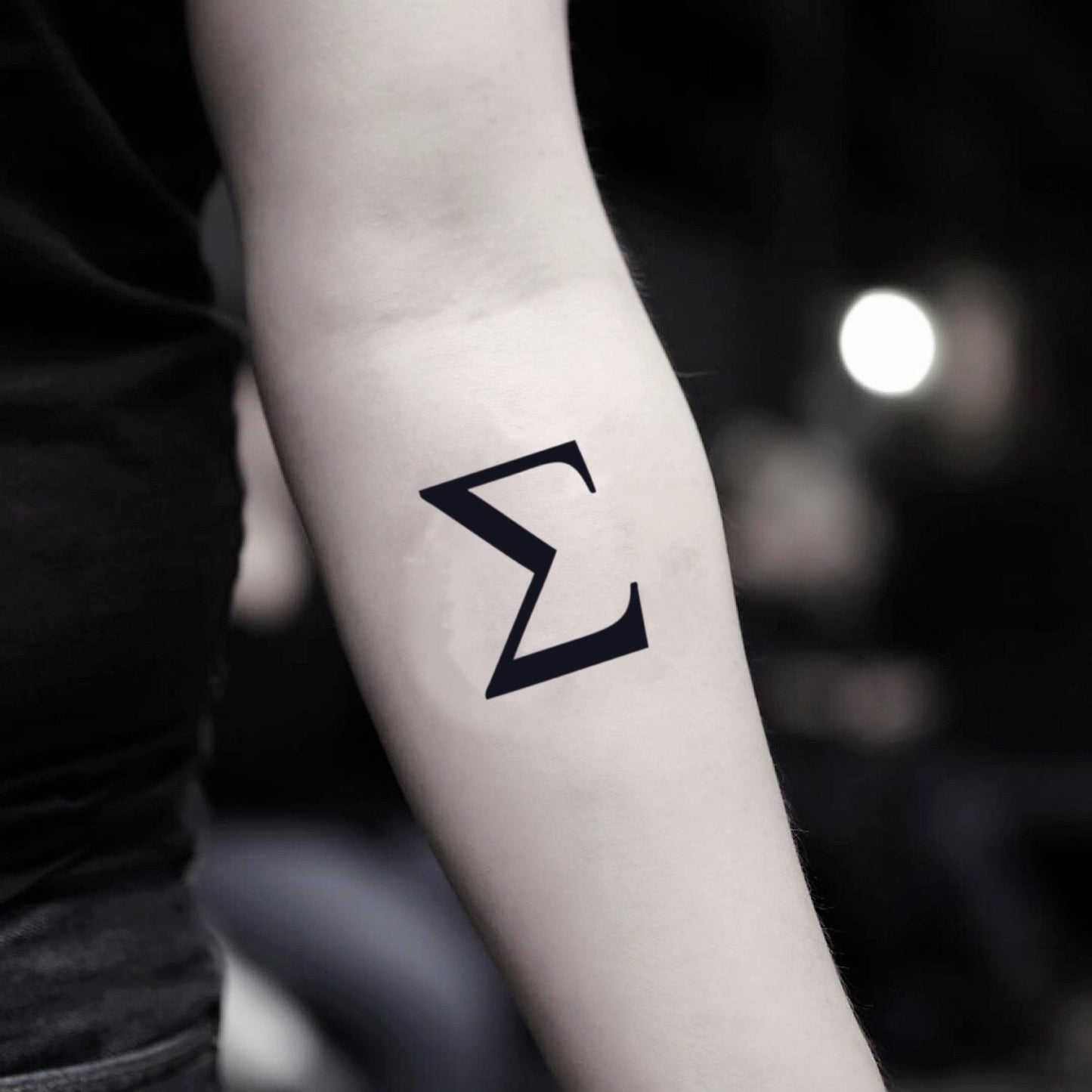 fake small sigma minimalist temporary tattoo sticker design idea on inner arm