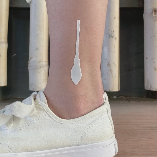 fake small witch broom simple halloween witchy wiccan witchcraft minimalist temporary tattoo sticker design idea on ankle leg