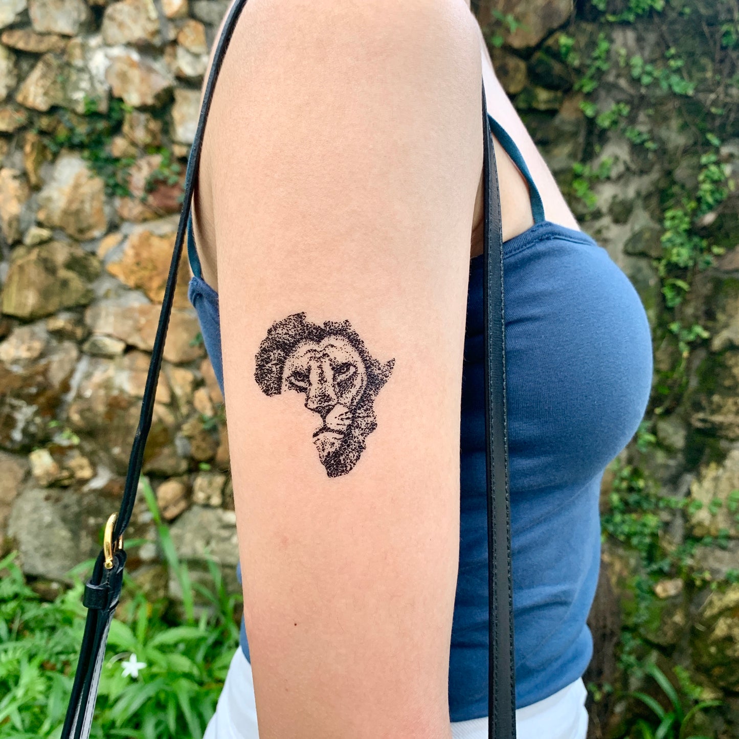fake small african map lion black culture animal temporary tattoo sticker design idea on upper arm