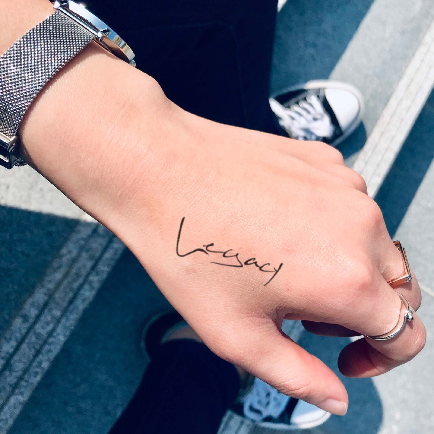 fake small legacy lettering temporary tattoo sticker design idea on hand
