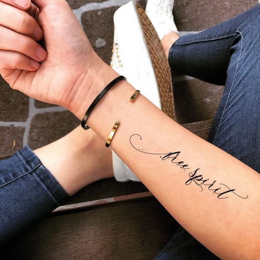fake medium free spirit lettering temporary tattoo sticker design idea on forearm