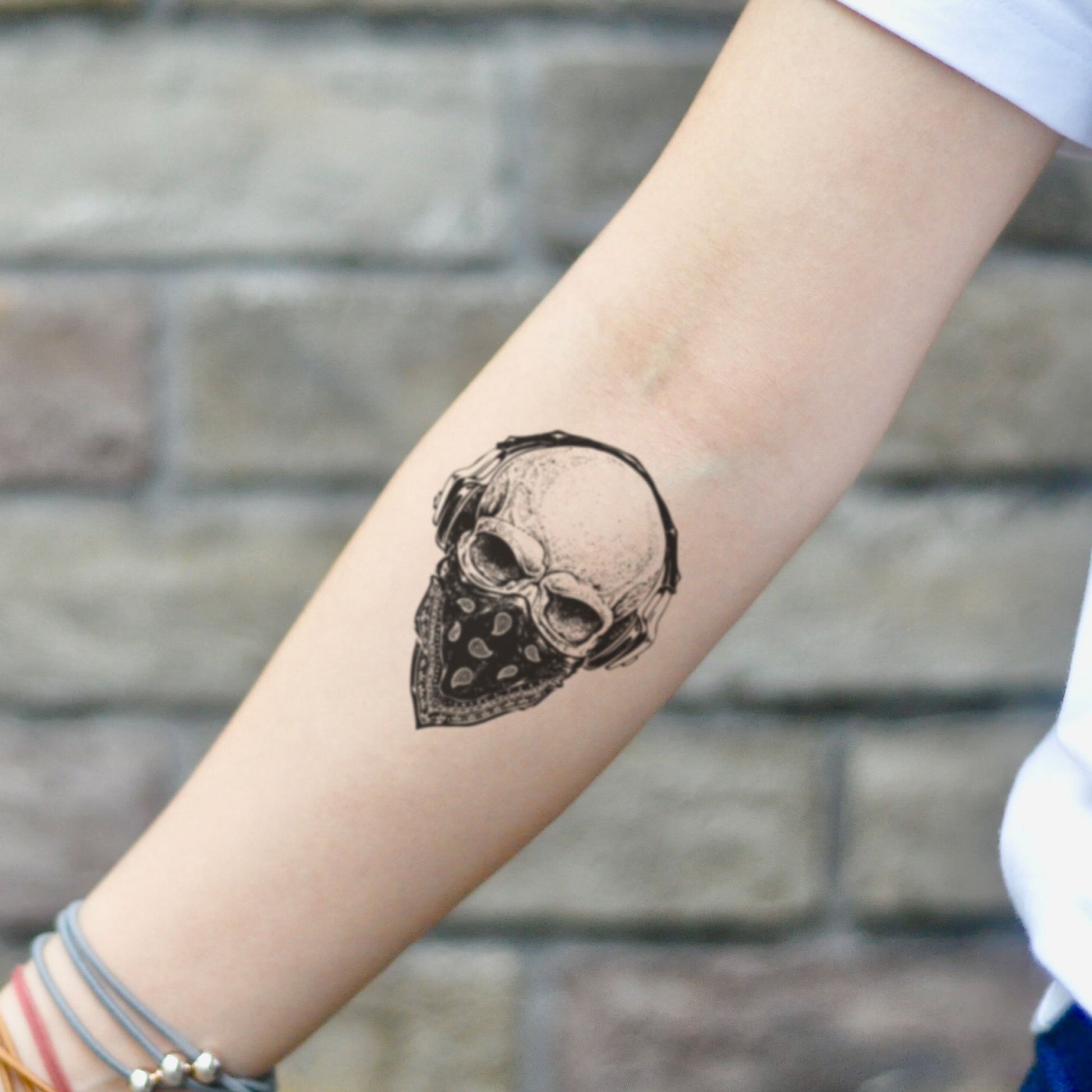 fake small bandana bandit skull illustrative temporary tattoo sticker design idea on inner arm