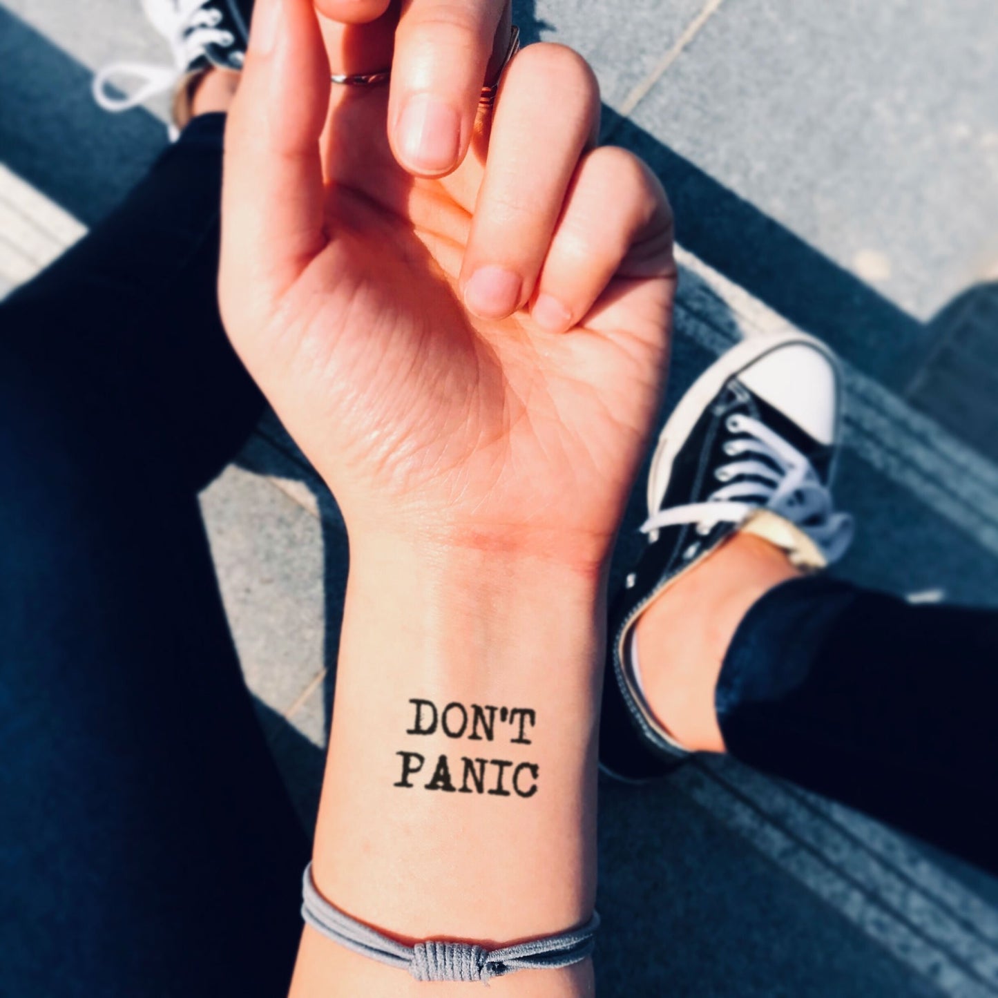 fake small don't panic Lettering temporary tattoo sticker design idea on wrist