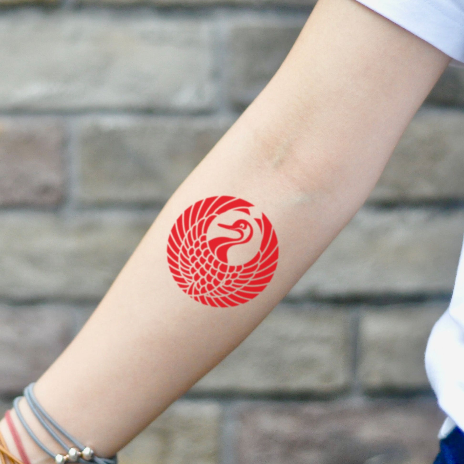 fake small japanese crane bird color temporary tattoo sticker design idea on inner arm
