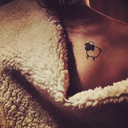 fake small little black sheep animal temporary tattoo sticker design idea on chest