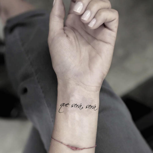 fake small que sera sera spanish quote lettering temporary tattoo sticker design idea on wrist