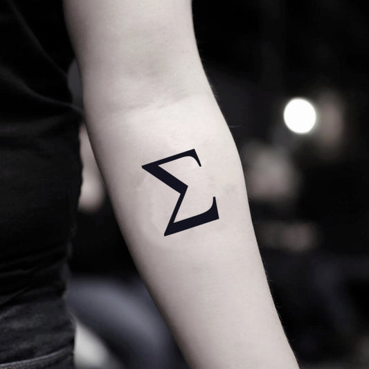 fake small sigma minimalist temporary tattoo sticker design idea on inner arm