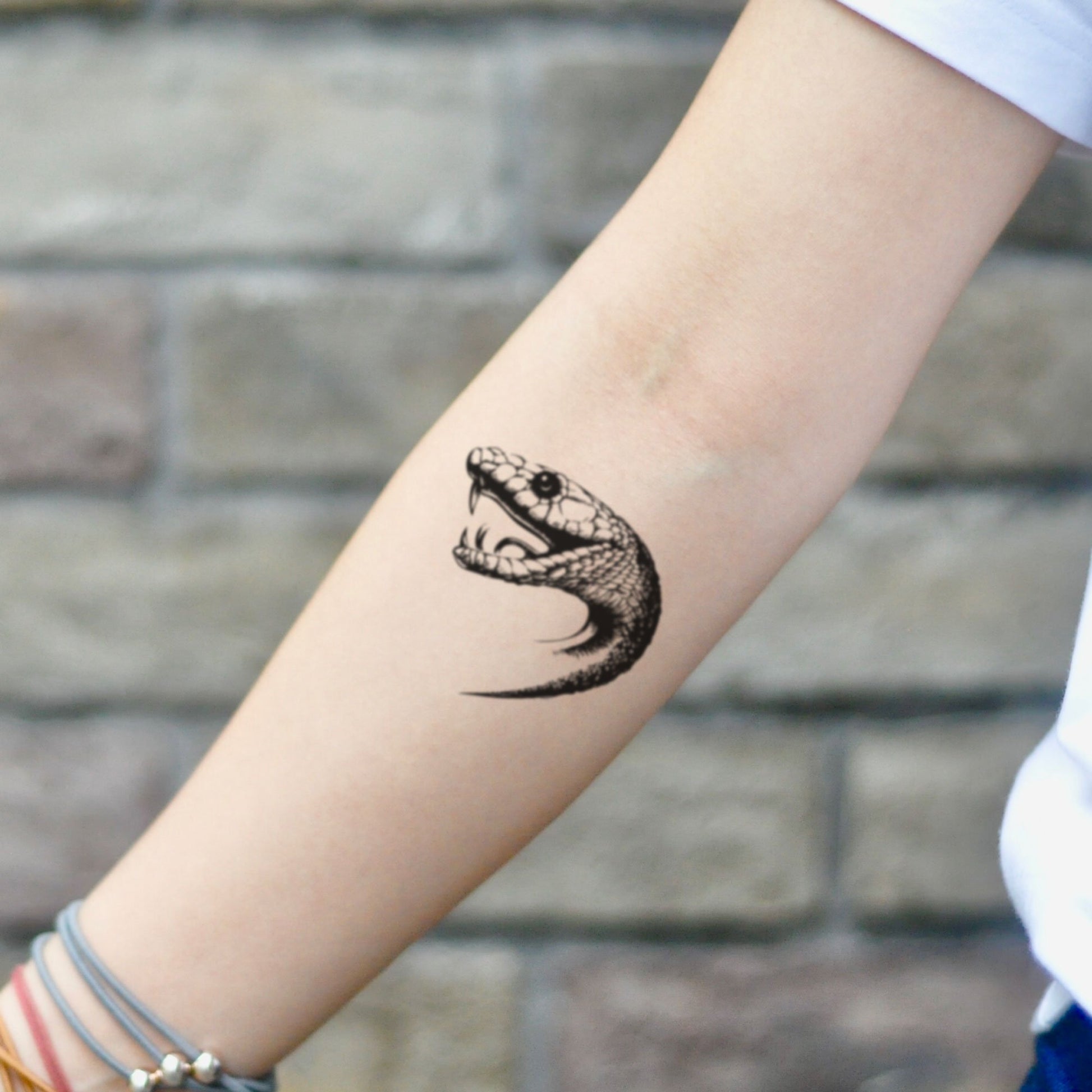 fake small snake head traditional old school animal temporary tattoo sticker design idea on inner arm