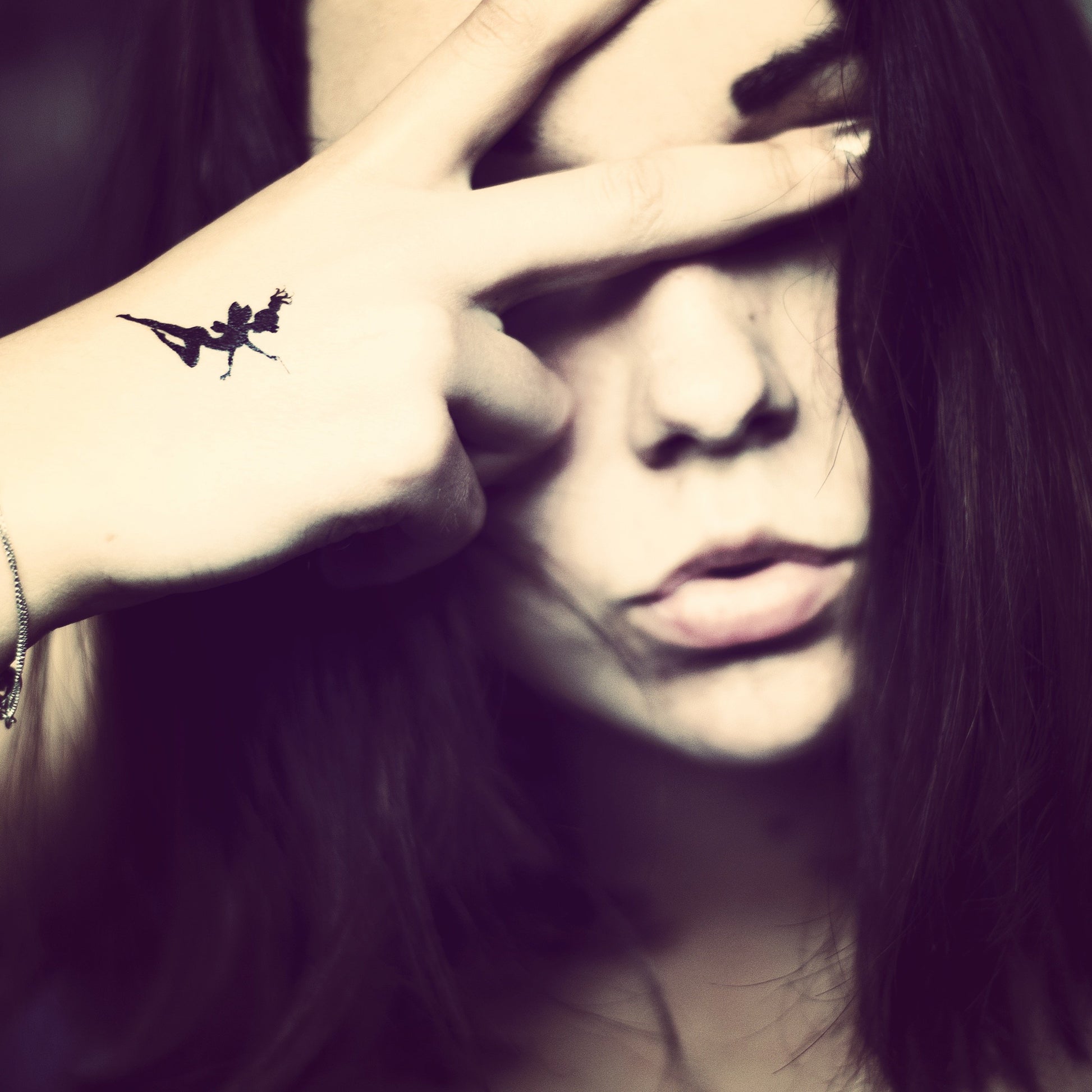 fake small tinkerbell cartoon temporary tattoo sticker design idea on wrist