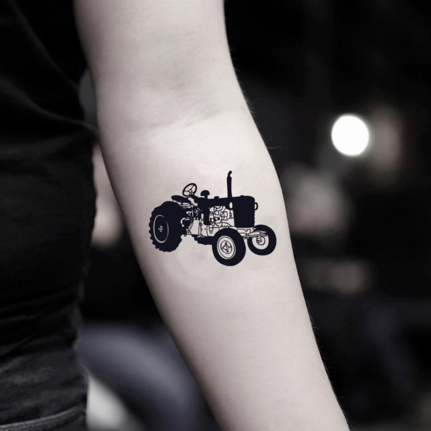 fake small tractor illustrative temporary tattoo sticker design idea on inner arm
