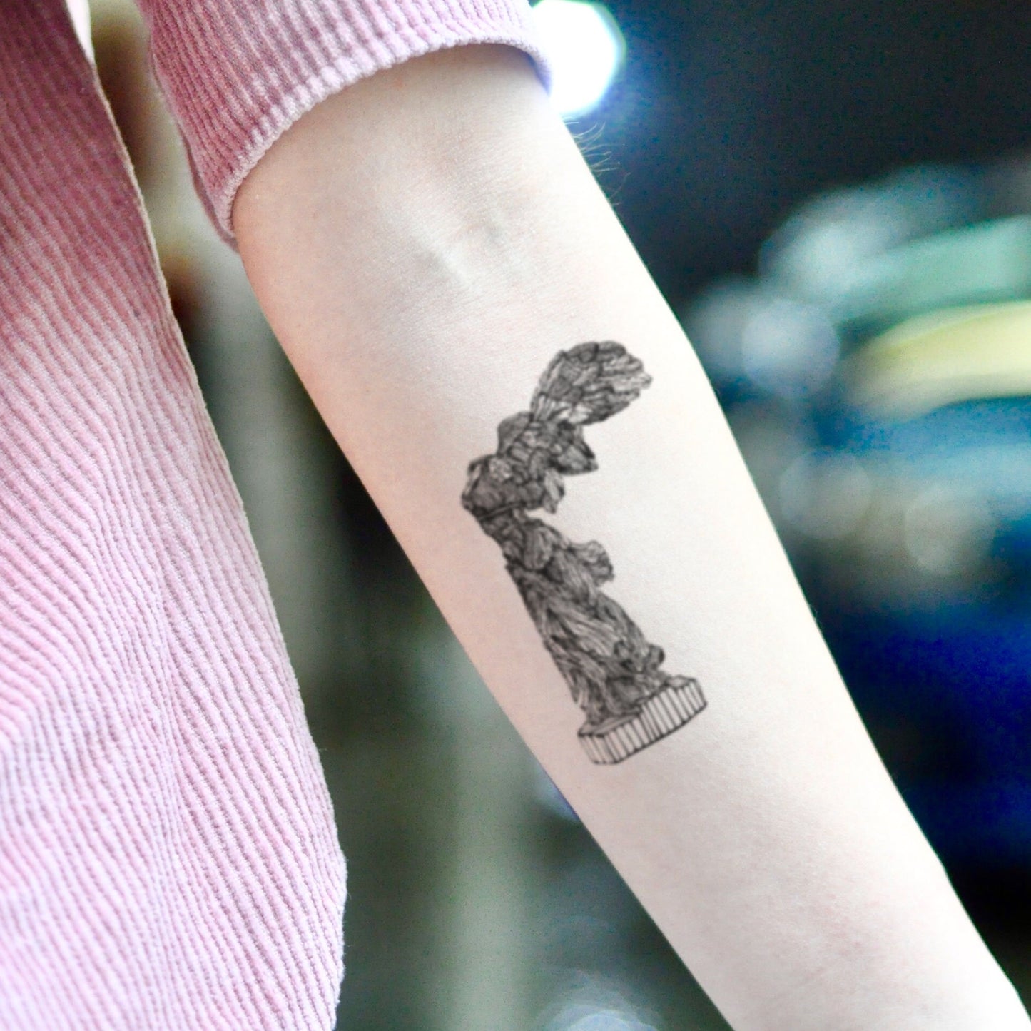 fake small winged victory of samothrace greek god goddess sculpture nike mythology angel statue illustrative temporary tattoo sticker design idea on inner arm